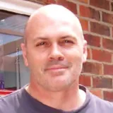 A photo of Bob healthy and in front of brick wall